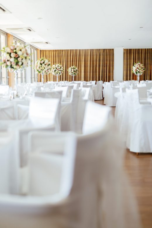 Beautiful wedding tables and roses in bouquet